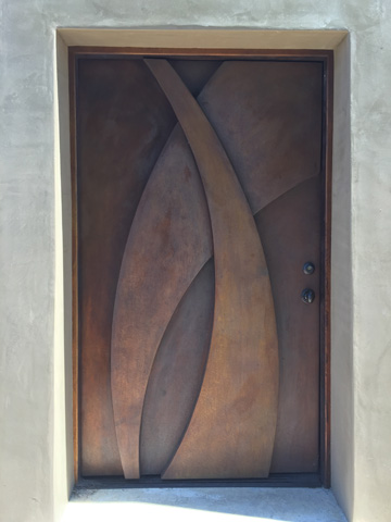 Image of a bronze door.