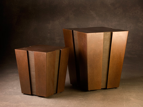 Image of two bronze tables with notches up the side.
