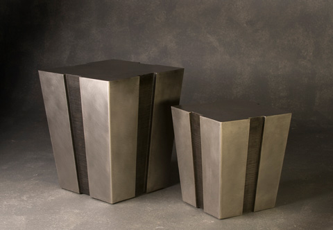 Image of two stainless steel tables with notches up the side.