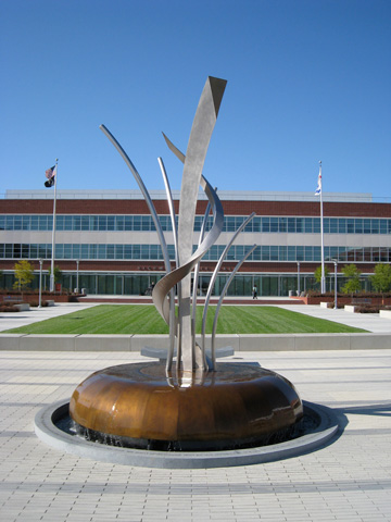 Image of large bronze and stainless steel water feature.