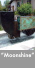 Thumbnail image of a large bronze and stainless steel water feature.