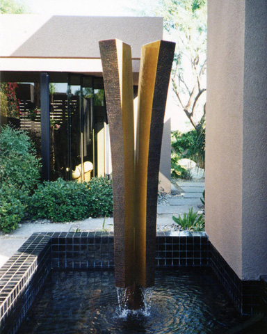 Image of a large bronze water feature.