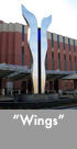 Thumbnail image of a large bronze, stainless steel and glass water feature.